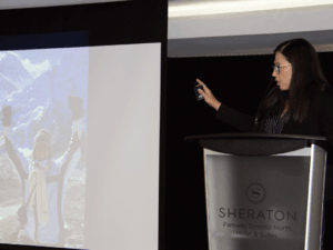 Jill speaking as a keynote speaker at the Curling Ontario Conference