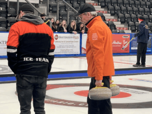 ice team moving rocks at the Curling Ontario Championships
