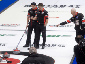 Glen Howard pointing to the ice on a time out with Team Ontario