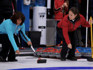Instructor demonstrating how to be in the hack to a learn to curl curler