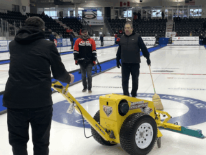 Ice team scraping the ice