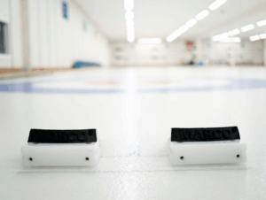 image of the "hack" out on the ice with the background of the rink blurred