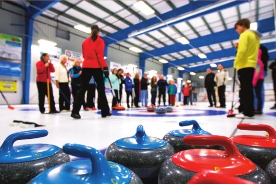 Learn to curl session with instructors and students our on the ice