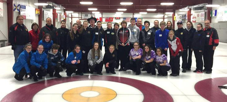 Navan-March-26-e1517586605248 Group of curlers on the ice taking a photo together that participated in a curling clinic