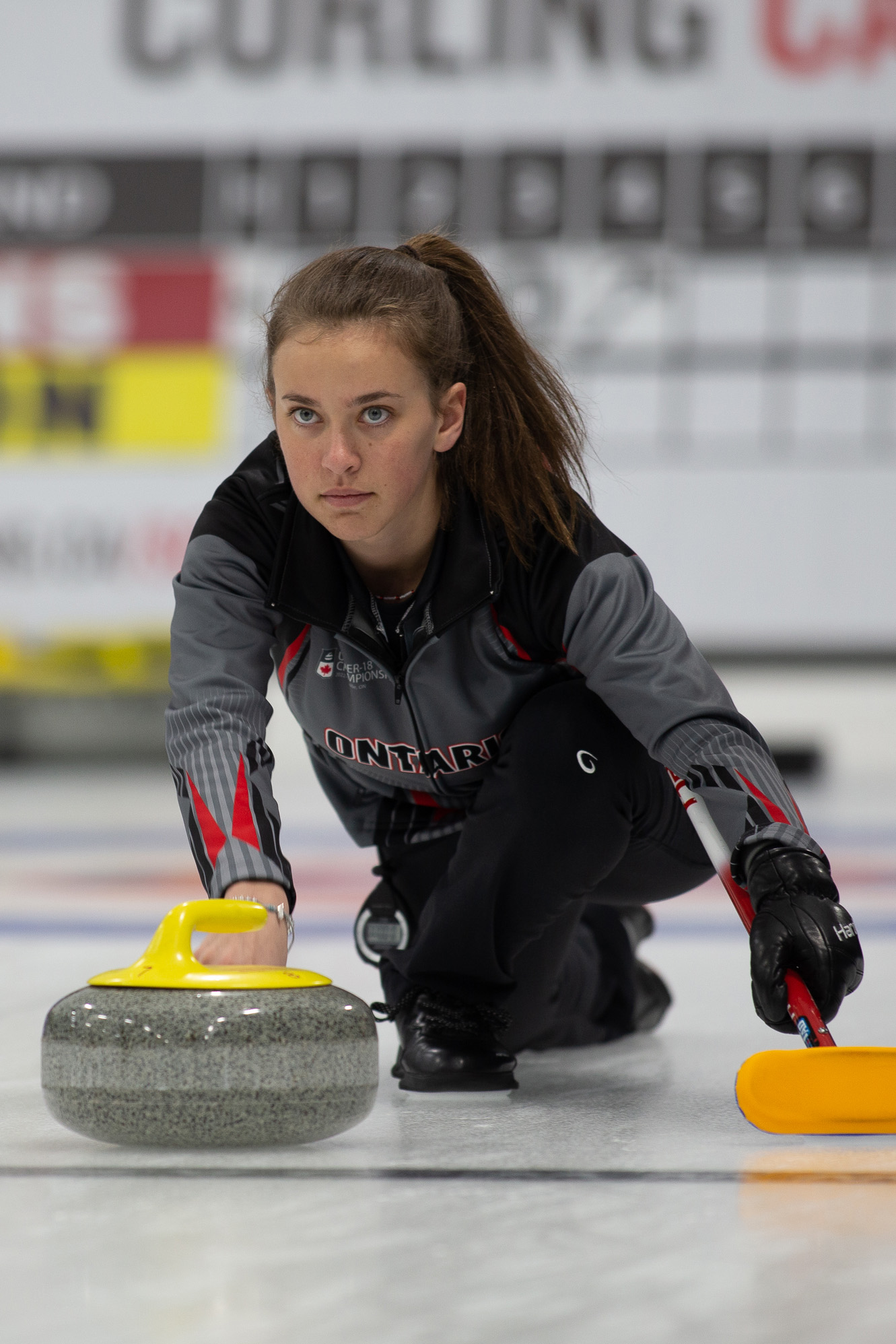 Youth Team Ontario female Athelete releasing a rock at nationals