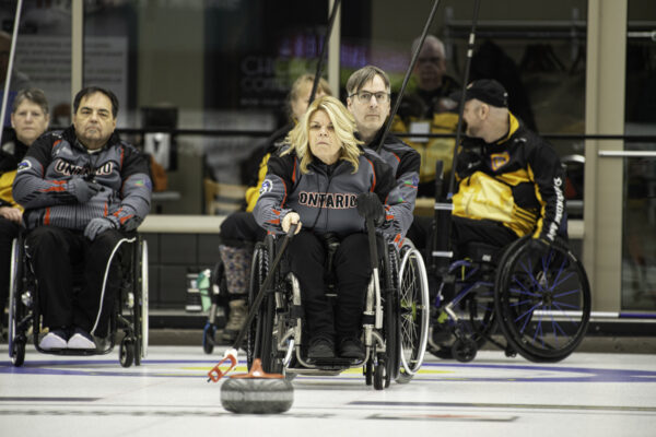 picture of the late shauna petrie throwing a rock at a Wheelchair competition as Team Ontario